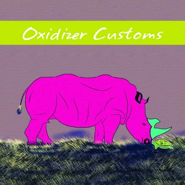 A pink rhino grazing on dark grass, a small green turtle at its nose, under an Oxidizer Customs banner